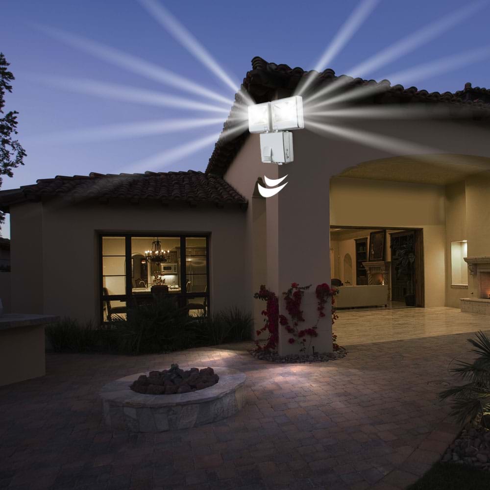 Wall mounted floodlights lighting outside of home